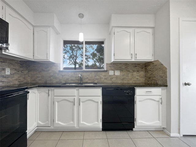 kitchen featuring tasteful backsplash, white cabinetry, sink, and black appliances