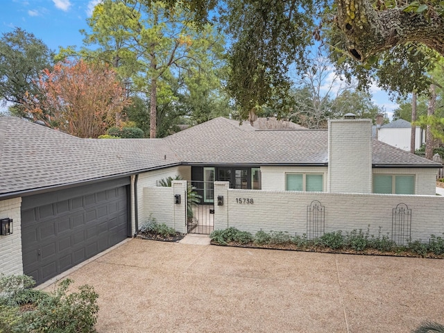 ranch-style house featuring a garage