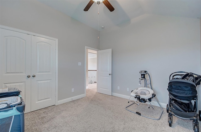 miscellaneous room with light carpet, vaulted ceiling, and ceiling fan