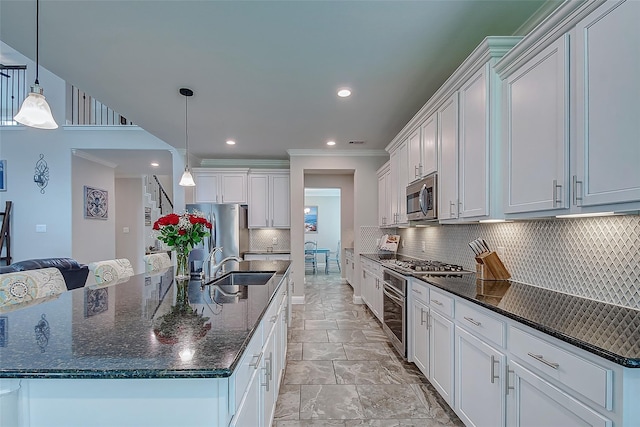 kitchen featuring pendant lighting, a large island, white cabinets, and appliances with stainless steel finishes