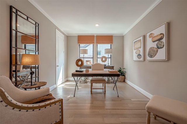 office featuring light hardwood / wood-style floors and crown molding