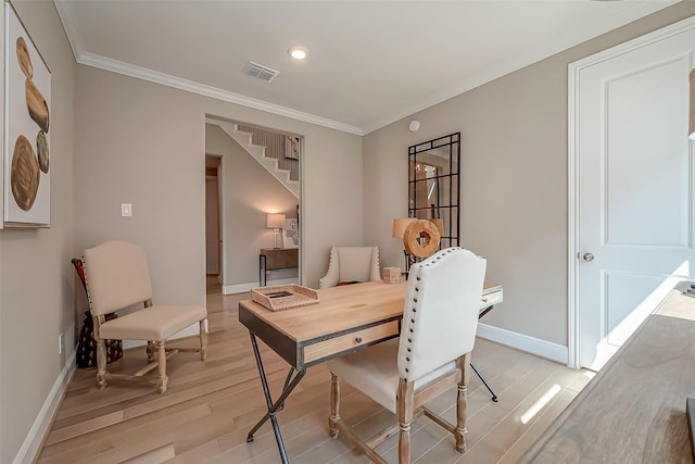 interior space with light wood-type flooring and crown molding