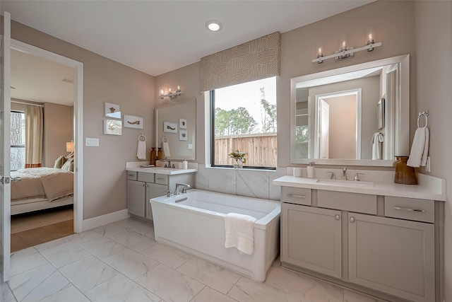 bathroom with plenty of natural light and vanity