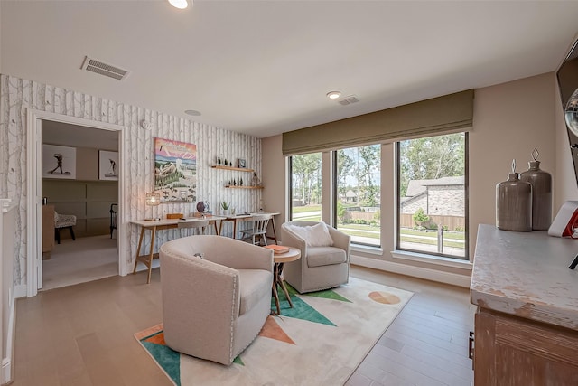 sitting room with light hardwood / wood-style flooring