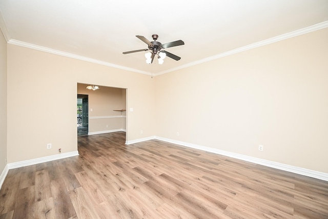 unfurnished room featuring light hardwood / wood-style floors, ceiling fan, and ornamental molding