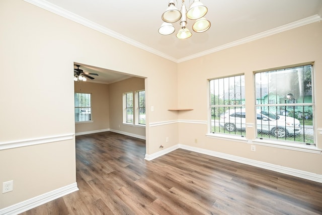 unfurnished room featuring ceiling fan with notable chandelier, crown molding, and dark wood-type flooring