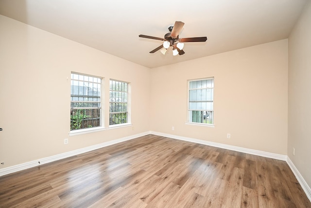 unfurnished room with light hardwood / wood-style flooring and ceiling fan