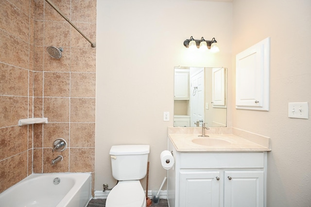 full bathroom featuring vanity, toilet, and tiled shower / bath