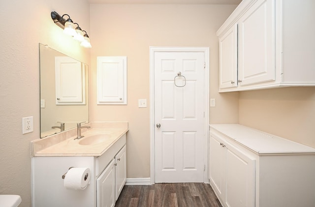 bathroom featuring hardwood / wood-style floors and vanity