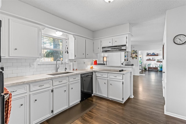 kitchen featuring black appliances, sink, kitchen peninsula, dark hardwood / wood-style floors, and white cabinetry