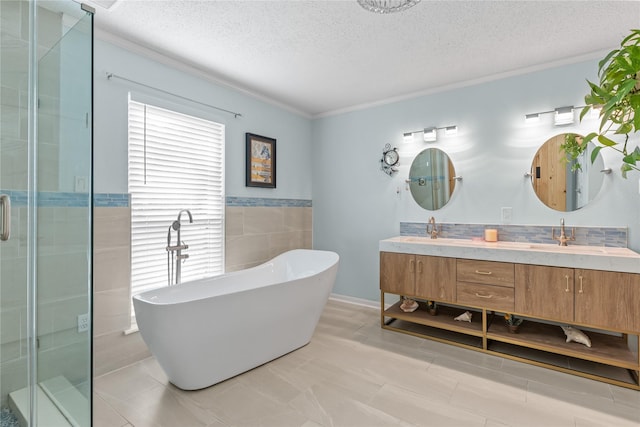 bathroom featuring vanity, a textured ceiling, tile walls, and independent shower and bath