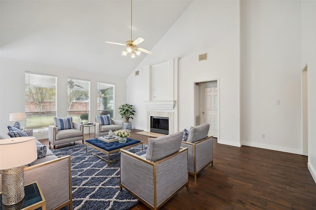 living room with ceiling fan, high vaulted ceiling, and dark hardwood / wood-style floors