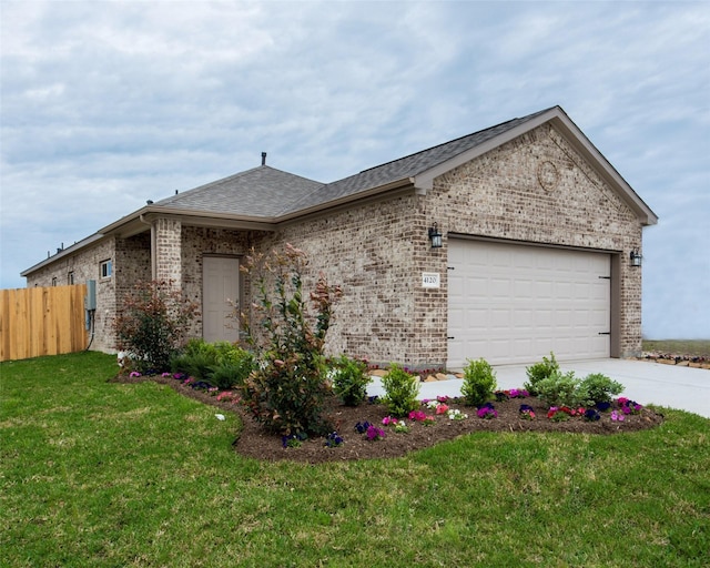 ranch-style home with a garage and a front lawn