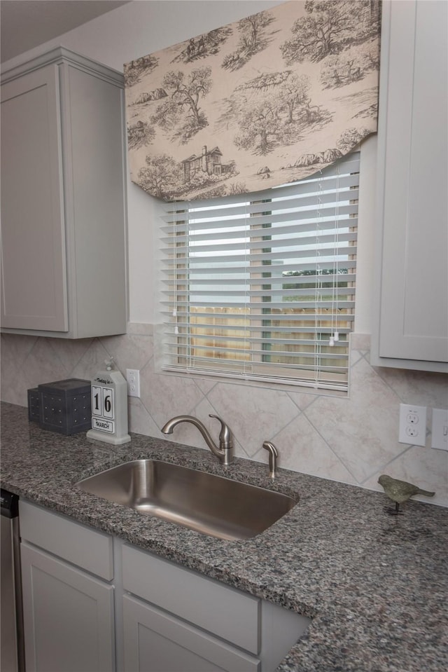 kitchen featuring gray cabinetry, decorative backsplash, sink, and dishwasher