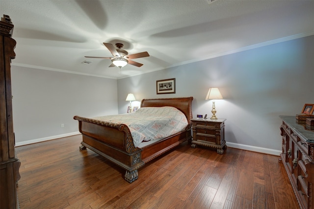 bedroom featuring crown molding, ceiling fan, and dark wood-type flooring