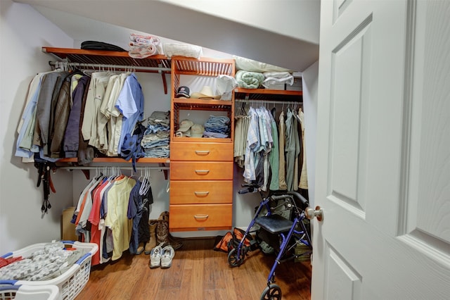 walk in closet featuring hardwood / wood-style floors