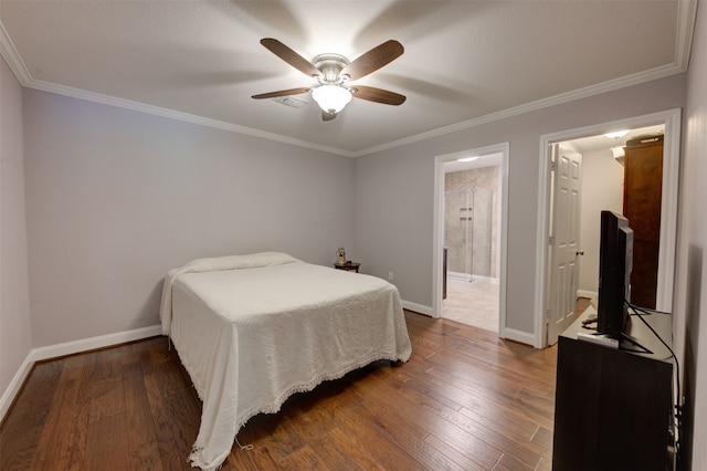 bedroom featuring ceiling fan, dark hardwood / wood-style flooring, crown molding, and ensuite bath