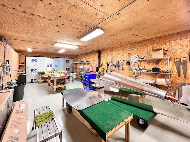 playroom with concrete floors and wood ceiling