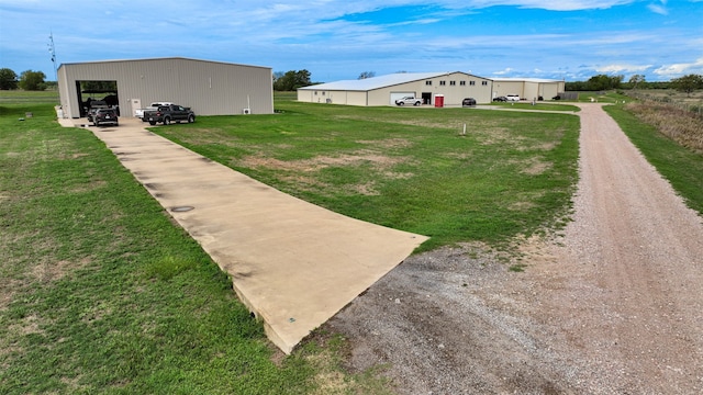 view of yard with an outbuilding and a garage