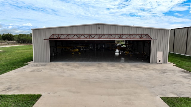 garage featuring a yard