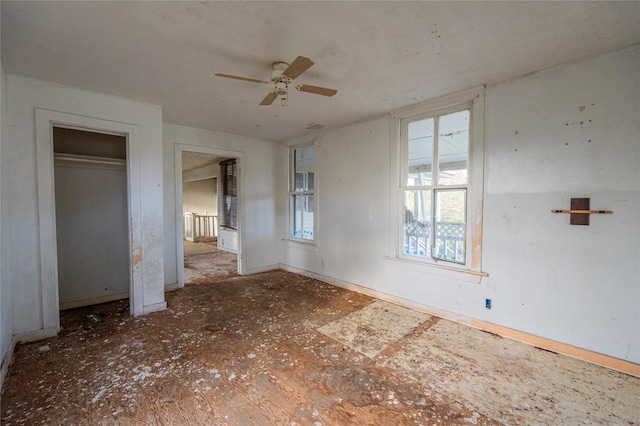 unfurnished bedroom featuring ceiling fan