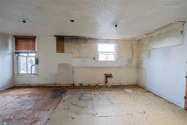 empty room with a textured ceiling