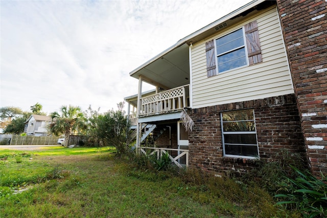 view of home's exterior with a yard