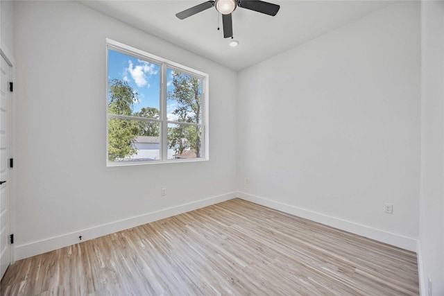 unfurnished room with light wood-type flooring and ceiling fan