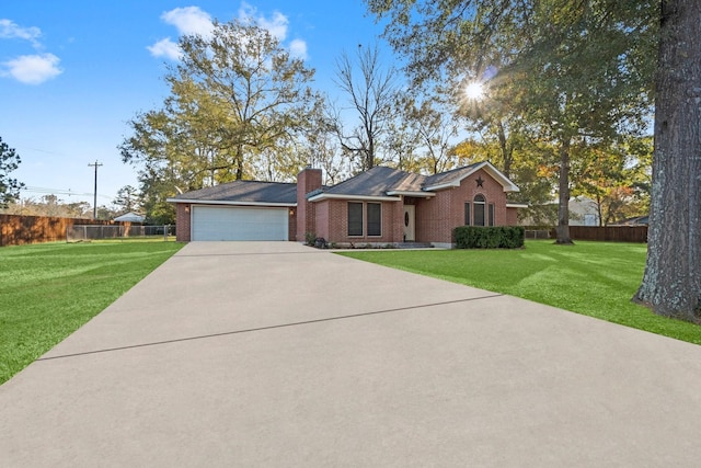 single story home with a front yard and a garage