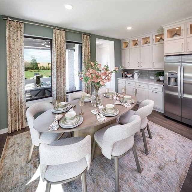 dining space with dark wood-type flooring