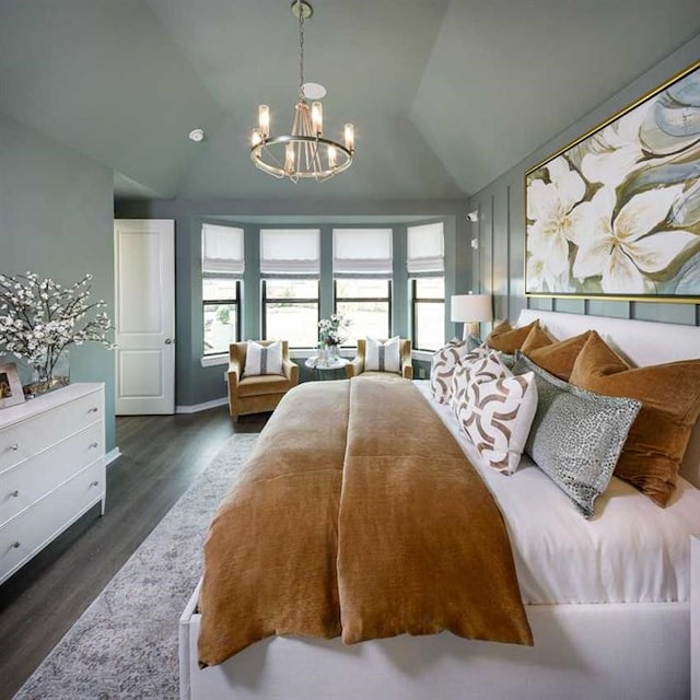 bedroom featuring a chandelier, dark hardwood / wood-style flooring, and vaulted ceiling