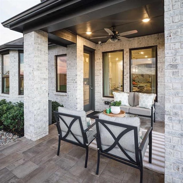 view of patio / terrace featuring an outdoor living space and ceiling fan