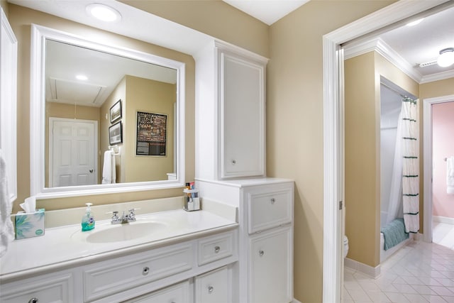 bathroom featuring tile patterned flooring, vanity, toilet, and crown molding