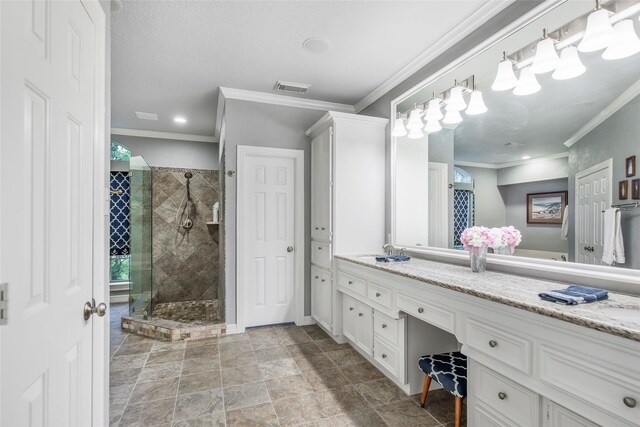 bathroom with vanity, a shower with shower door, and crown molding