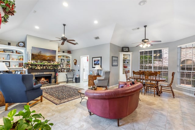 living room with ceiling fan, built in features, and lofted ceiling