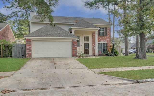 view of front of property featuring a garage and a front yard