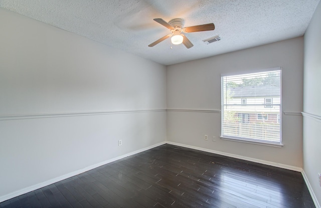 unfurnished room with a textured ceiling, dark hardwood / wood-style flooring, and ceiling fan