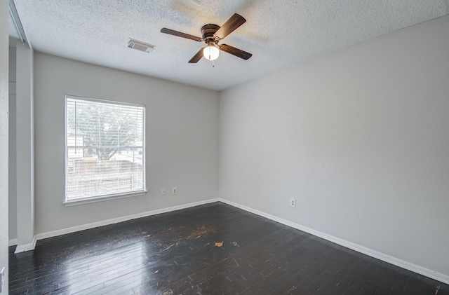 unfurnished room with a wealth of natural light and dark wood-type flooring