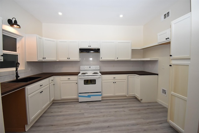 kitchen featuring electric stove, sink, white cabinets, and light hardwood / wood-style floors