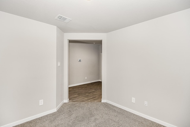 unfurnished room with carpet flooring