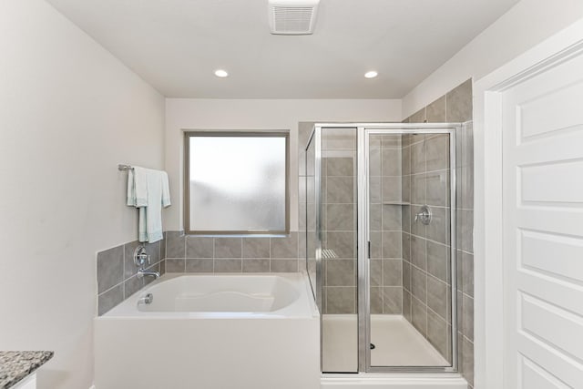 bathroom with independent shower and bath