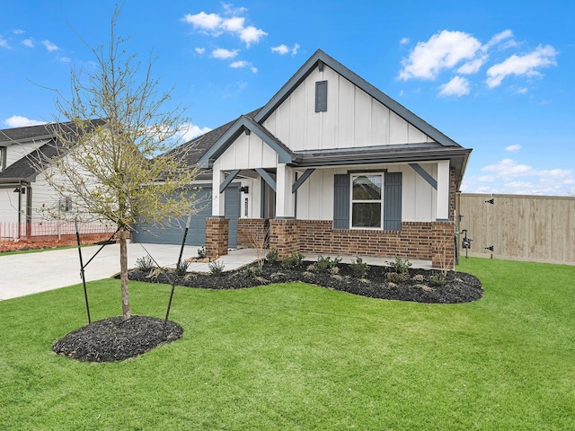 view of front of home featuring a front yard and a garage