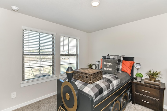 bedroom with light colored carpet