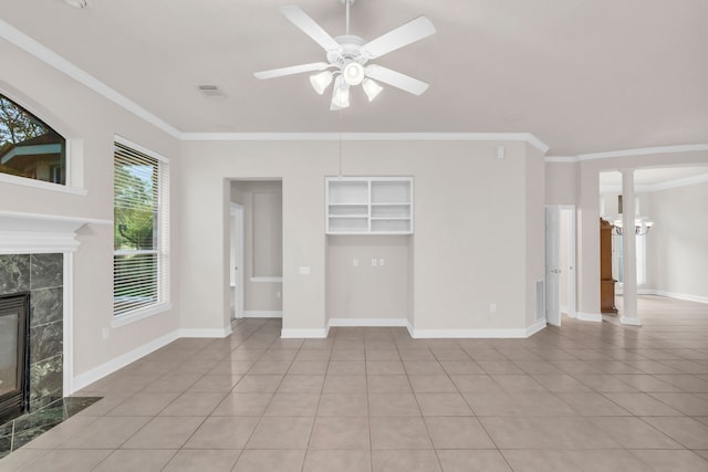 unfurnished living room featuring ceiling fan with notable chandelier, light tile patterned floors, crown molding, and a high end fireplace