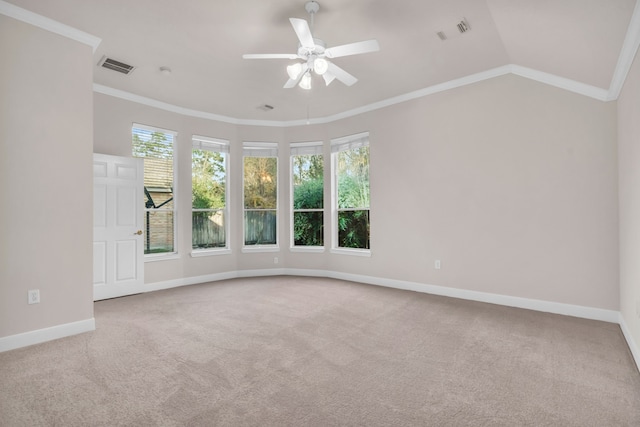 empty room with ceiling fan, ornamental molding, light carpet, and lofted ceiling