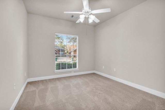 carpeted empty room with ceiling fan