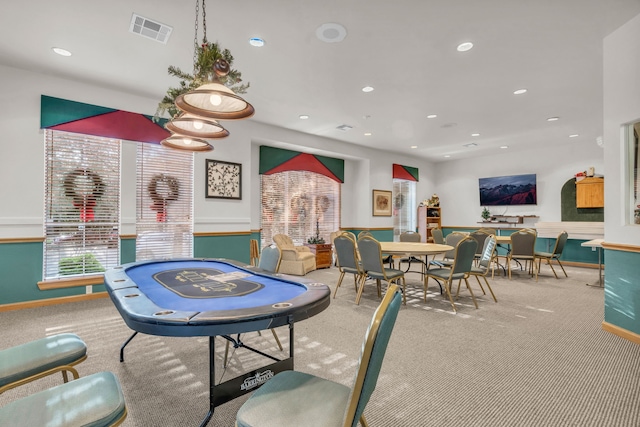 game room with light colored carpet