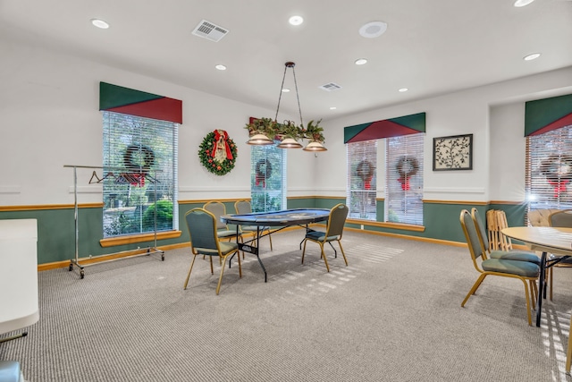 dining area with carpet flooring and a healthy amount of sunlight