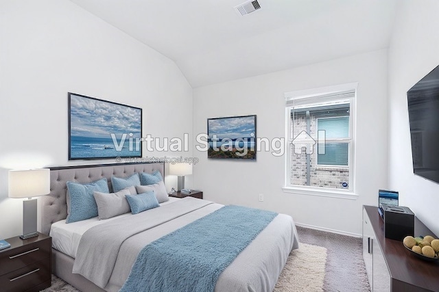 bedroom featuring carpet and vaulted ceiling