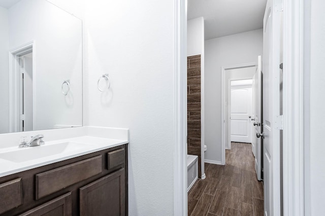 bathroom with vanity and hardwood / wood-style flooring